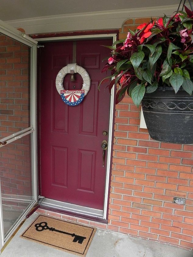 red white blue front porch updates, patriotic decor ideas, porches, seasonal holiday decor, wreaths, A patriotic wreath for summer