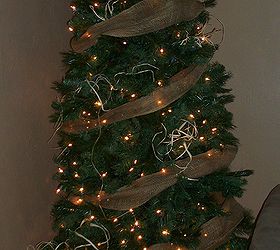 how to decorate a christmas tree, christmas decorations, seasonal holiday decor, After sprucing up the branches and securing the tree light and garland go on