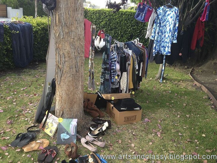 my garage yard moving sale tips, cleaning tips, outdoor living, 5 Hang up Clothes It s much easier for your shoppers to find the cute clothes you are selling I suggest hanging a rope or wire between trees to display this Or hang them on a picket fence We found that to amazing for hanging cl