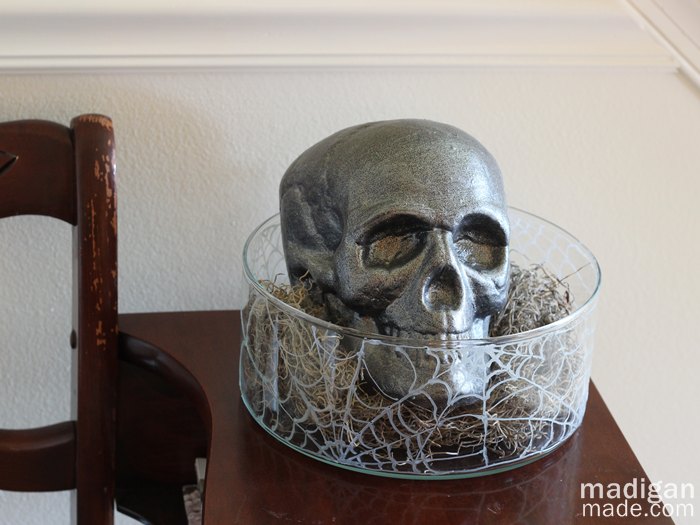 simple handmade fall decor ideas, crafts, halloween decorations, seasonal holiday decor, A painted skull peers out of a simple spiderweb painted vase