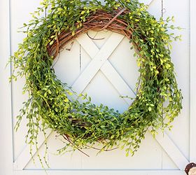how to make a spring wreath, crafts, seasonal holiday decor, wreaths, Wrap a grapevine base with greenery I used 2 strands of garland