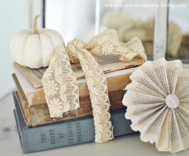simple fall decorating with baby boo pumpkins, seasonal holiday d cor, Tie vintage books up with old lace and crown the stack with a Baby Boo pumpkin