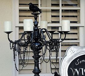 a spooky front porch and entry, halloween decorations, porches, seasonal holiday decor, We made this standing candelabra out of an old floor lamp and a brass chandelier