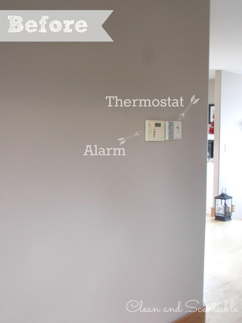 how to cover up a wall thermostat or home alarm, home decor, wall decor, Our thermostat and alarm box were placed in an awkward spot on the wall and made it difficult to hang anything around them