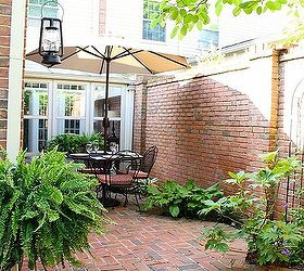 my ralph lauren courtyard, flowers, gardening, outdoor living, We added ferns roses annuals and vines that will grow and soften the look of the brick That makes the area seem more intimate and inviting
