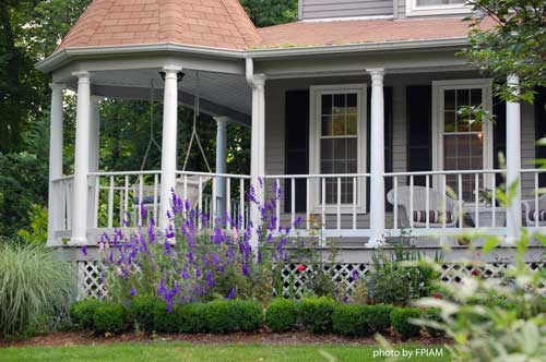 landscaping around your porch, curb appeal, flowers, landscape, Flowers and boxwood create a simple beautiful transition from porch to landscape