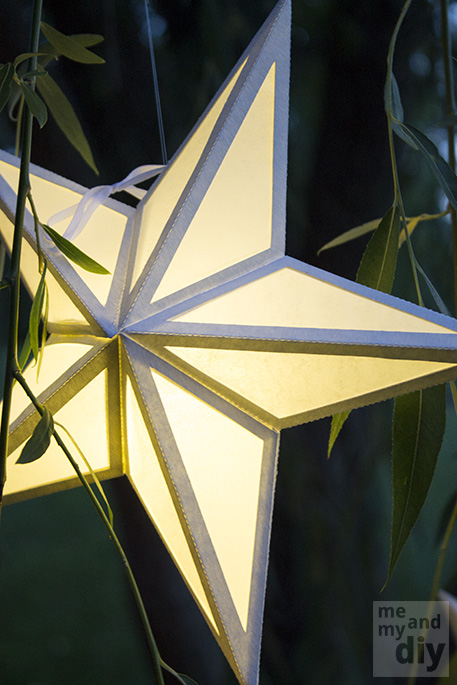 crie uma pequena atmosfera com as lanternas de papel em forma de estrela