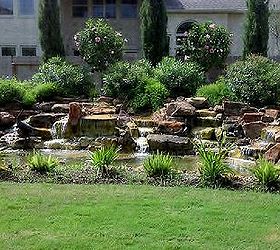 james wanted a twenty two foot wide waterfall in his sugarland texas backyard, landscape, outdoor living, ponds water features, The finished project is just awesome The landscapers that hired us finished out the look after we were through with our part