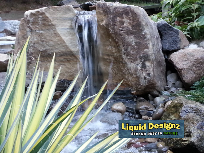 a knockout beautiful pondless waterfall greets our guests as they visit the liquid, landscape, lighting, ponds water features, It always is worth the effort to create that special unique falls