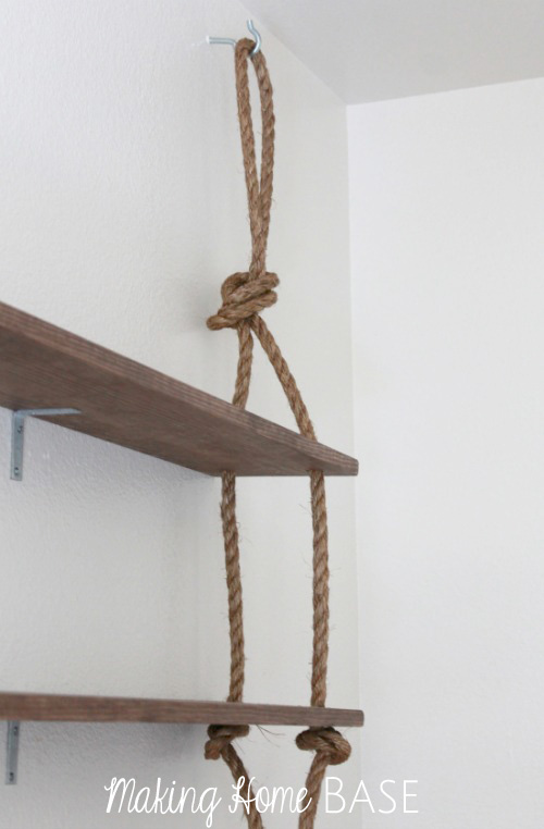 rustic diy wall shelving, diy, how to, shelving ideas, woodworking projects, Using large hook screws to hang the rope Since the rope is only for aesthetics we were able to use these hook screws are not worry about the weight of the shelves The shelves are sturdily in place because of the braces