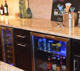 an entertaining basement remodel, basement ideas, entertainment rec rooms, home improvement, In additional to cabinet space the back wall includes a wine cooler and a beverage cooler Countertops are New Venetian Gold with a waterfall edge