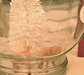 diy holiday waterless diorama style snow globes, crafts, seasonal holiday decor, once dry screw the lid back on and give it a slight tilt so some of the glitter and fine snow particles coat the inside a bit