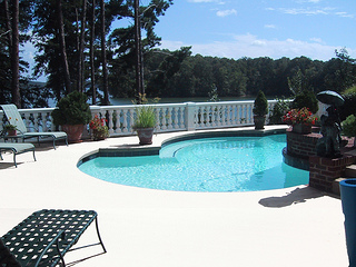 you may be ready for swimming this summer but is your pool deck, decks, pool designs, seasonal holiday decor, An aluminum pool deck stays cooler to the touch than traditional decking and is slip resistant