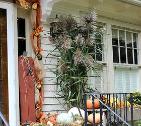 outdoor decorating for fall, porches, seasonal holiday decor, Garland around the door made with Deco Mesh pumpkins and tall grasses on the porch