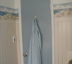50s bathroom budget facelift, bathroom ideas, home decor, It was cheaper just to paint the old door to match the vanity and it helped balance the design I added a chrome hook to match all the new towel racks and hardware