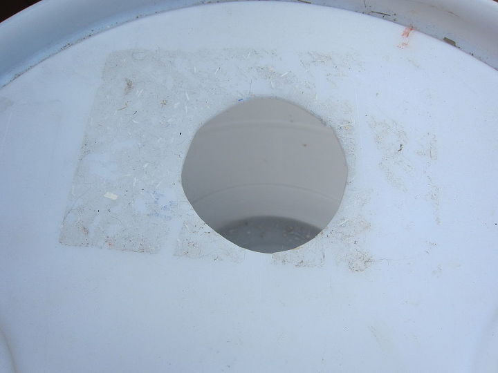 diy rain barrel, go green, hole to attach barrel to downspout
