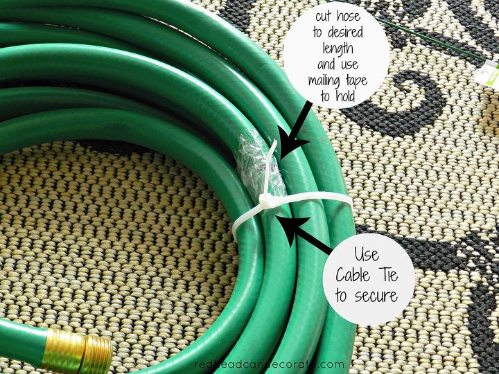 garden hose wreath, crafts, repurposing upcycling, wreaths, Very simple tutorial Our hose was way too large I used kitchen scissors to cut out the center section leaving enough to still have a wreath left I then taped the ends with mailing tape and secured the entire hose with a cable tie