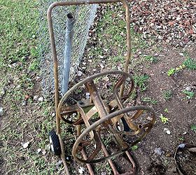 old garden hose reel and a 39 year old wheel barrow