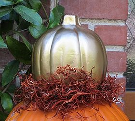 my fall front porch, porches, seasonal holiday decor, I love gold spray paint The top pumpkin was a cheap light up one from the dollar store I removed the lighting bit so there was a hole on the bottom just slide it over the orange pumkin s stem