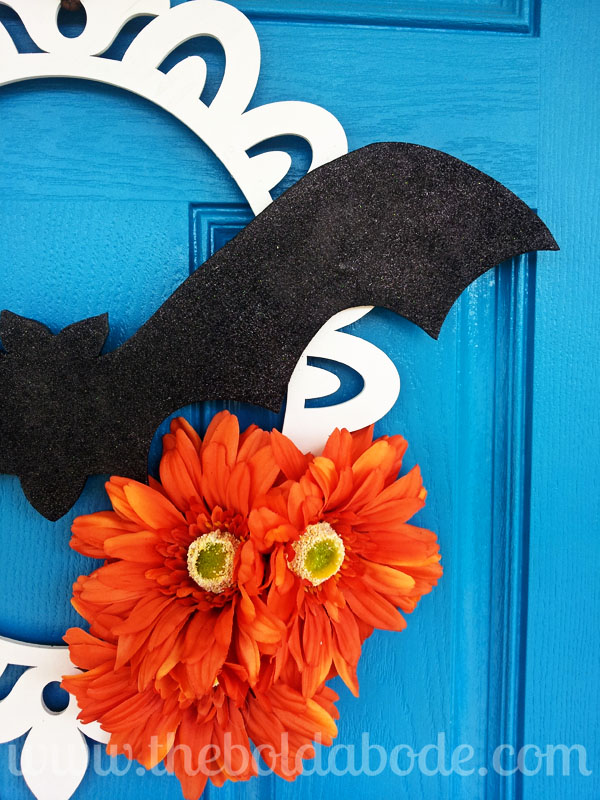 a batty halloween wreath, crafts, home decor, wreaths, Attach it to a lasar cut wreath with some bright daisies