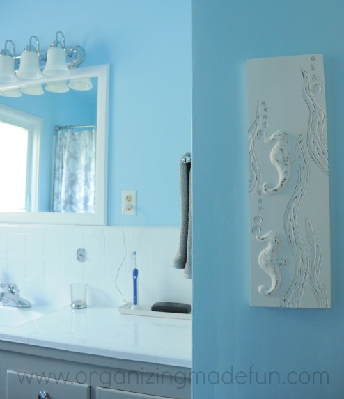before and after of kids bathroom, bathroom ideas, countertops, home decor, New mirror and sea horse art