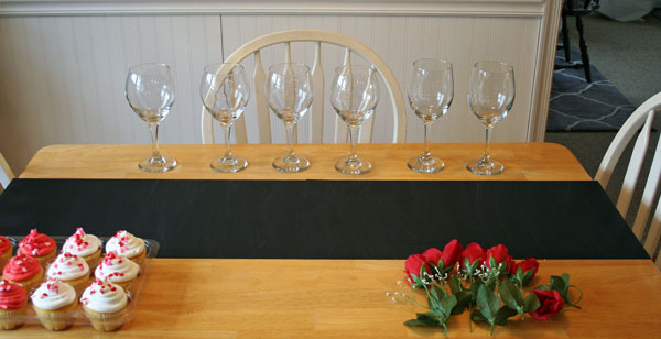 diy valentine s day table, painted furniture, seasonal holiday decor, valentines day ideas, Gather wine glasses cupcakes roses fake or real
