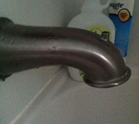 el desviador de la ducha se ha roto, Y no no puedo quitar eso de la pared