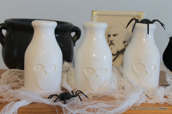 skull vase pottery barn knock off, crafts, halloween decorations, seasonal holiday decor, Thrift store vases some foam and spray paint