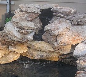 building a backyard pond, outdoor living, ponds water features, Built landscape rocks up and around a pre fab water fall feature
