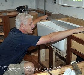 adding a farm sink to existing cabinets, diy, how to, kitchen design, repurposing upcycling, The Husband built in The Queen adding support underneath this baby was bigger than the existing sink and the cabinet doors had to be adjusted to accommodate the new addition Soooo we had to have new cabinet doors