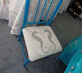 my vintage beach inspired and very thrifted guestroom is done, bedroom ideas, home decor, heres the chair I did last week Same method I used on the pillow graphics fairy graphic used blockposters com to slice it into 4 pieces had it printed using toner and used my chartpack blender pen to transfer the image