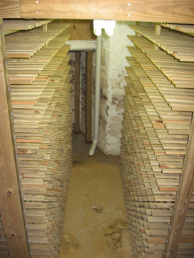 historic renovation, home improvement, BEFORE This shows the original a root cellar and later wine storage below the unfinished basement This became the wine cellar shown in the finished photos