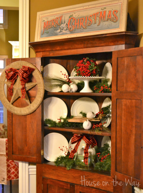 a christmas decorated corner cabinet, christmas decorations, seasonal holiday decor