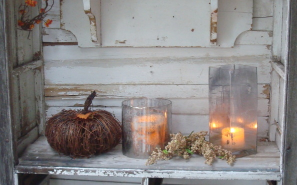 autumn rainy days candles, repurposing upcycling, seasonal holiday decor, The glass containers were spray painted with Krylon looking Glass and weathered outdoors