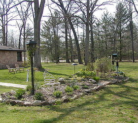 small house under a big sky backyard feeding bed, landscape, outdoor living, perennial, Very early year long view of the bed in the early spring before the White Oak canopy fills out
