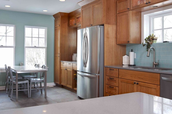 5 top wall colors for kitchens with oak cabinets, kitchen design, paint colors, painting, wall decor, This kitchen with Amber toned cabinets and stainless appliances looks fresh and updated with the addition of blue gray walls