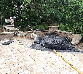 landscape garden design waterfalls water feature patio sitting wall with pillars, Once the Paver Patio Wall and Pillars were in place It was time to build the new Waterfall Water Feature for this residence in Brighton NY by Acorn Landscaping of Rochester NY Basin is dug out with Aqua Blocks seen here