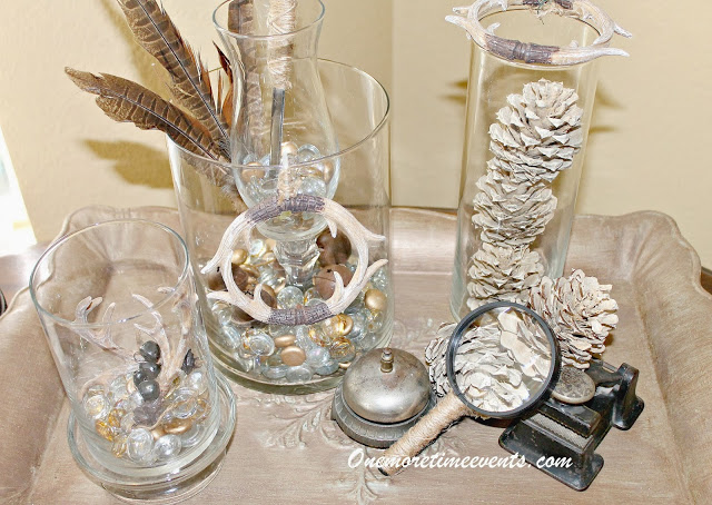 masculine christmas vignette with a touch of elegance, crafts, seasonal holiday decor, Filling Cylinder vase with vase fillers and Christmas Ornaments bleached pin cones and twine wrapped desk items