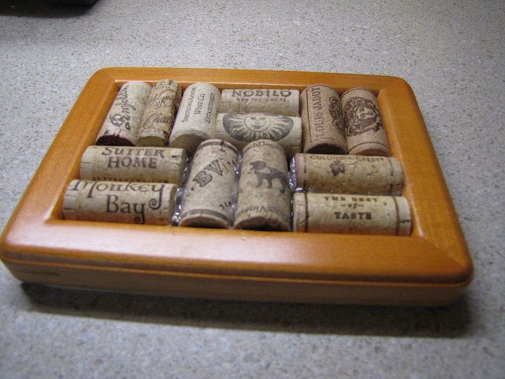 uses for wine corks, crafts, repurposing upcycling, Use a picture frame add a cardboard backing then glue on wine corks for a trivet