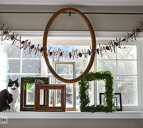 expect the unexpected with this junker s christmas home tour, seasonal holiday d cor, wreaths, Jazz up a plain window with a few empty frame