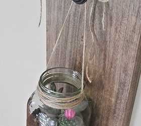 rustic succulent terrarium, crafts, flowers, gardening, mason jars, succulents, terrarium, After drilling a hole in a 1x10x18 plank of poplar wood I stained it and added a knob Finally hanging the beautiful terrarium from the knob