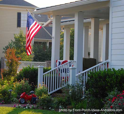 porches with patriotic appeal, curb appeal, outdoor living, patriotic decor ideas, seasonal holiday decor, A single bunting with a flag decorates a smaller porch
