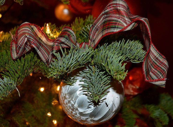 holiday decor tying ornaments to the tree, seasonal holiday decor