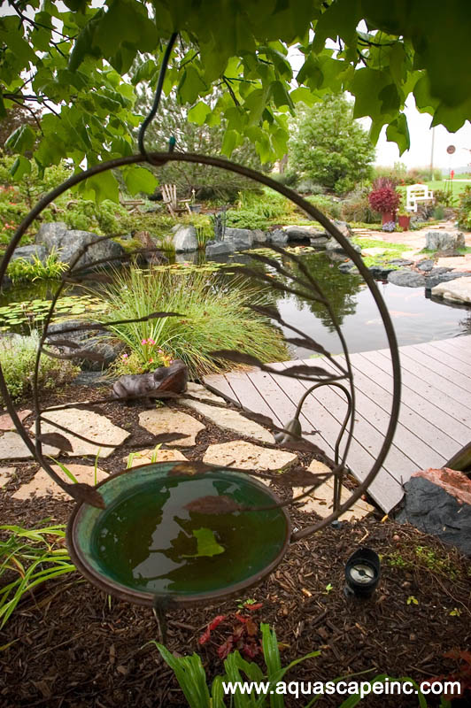 outdoor living with water gardens, curb appeal, decks, outdoor living, patio, ponds water features, Garden art looks right at home in this watery wonderland