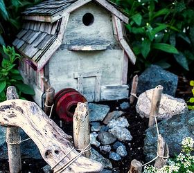 farm styled fairy garden with a birdhouse, flowers, gardening, ponds water features, A barn styled birdhouse plus found objects created this little garden theme http www funkyjunkinteriors net 2012 06 outdoor fairy garden farm style html
