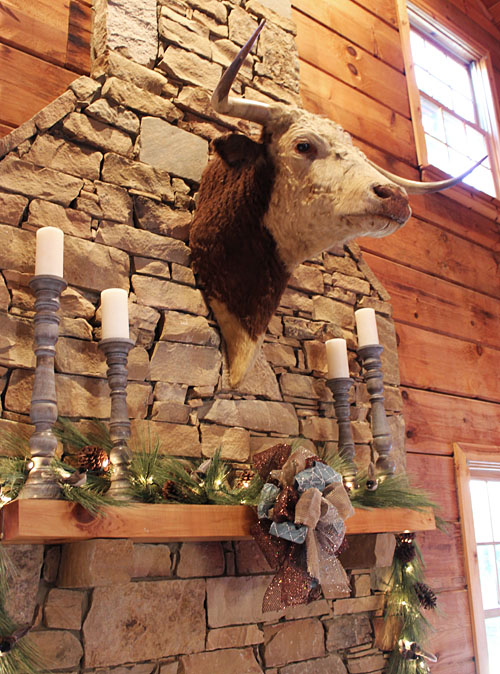 decorating a log cabin for christmas, christmas decorations, fireplaces mantels, seasonal holiday decor, wreaths, Here is the fireplace mantel The bull watched my every move