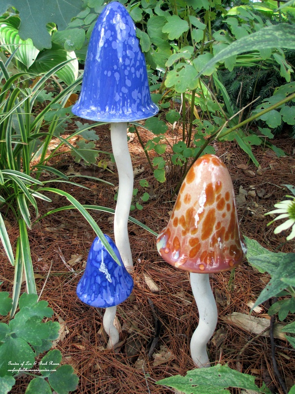 garden accents pottery mushrooms, flowers, gardening, These whimsical pottery mushrooms have been a fixture in my gardens for some time now They provide a unique pop of color and interest in one of my shady flower beds