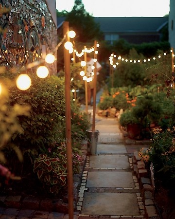 how to stress free outdoor entertaining, outdoor living, Light candles and hang garden lights I use citronella candles for double duty of bug control and ambiance