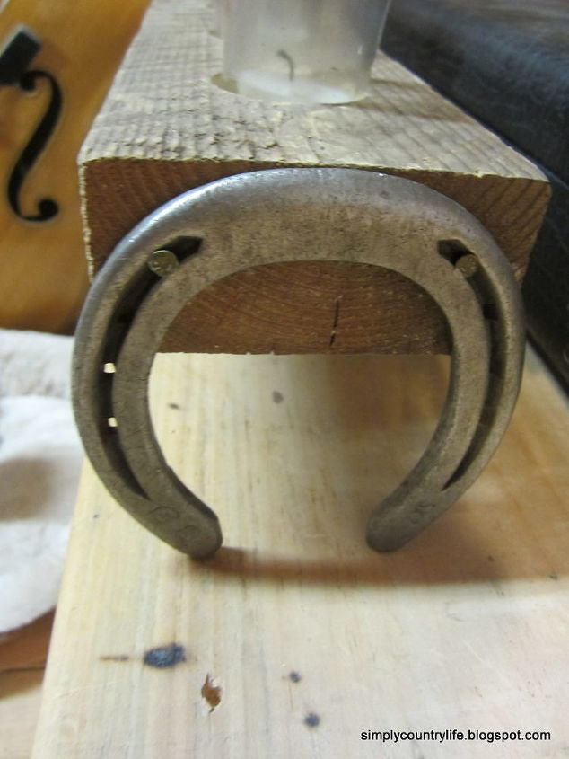 repurpose horseshoes and wood into a rustic country candle holder, crafts, repurposing upcycling, horseshoes attached