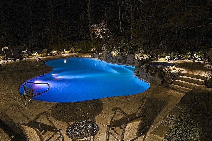 pool patio too hot concrete paver slabs look like stone with low heat, Blue glow from the LED lights in the pool at night